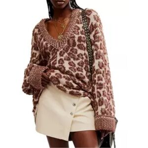 Lower price and it’s firm!! Free People leopard V-neck sweater size medium.  NWT